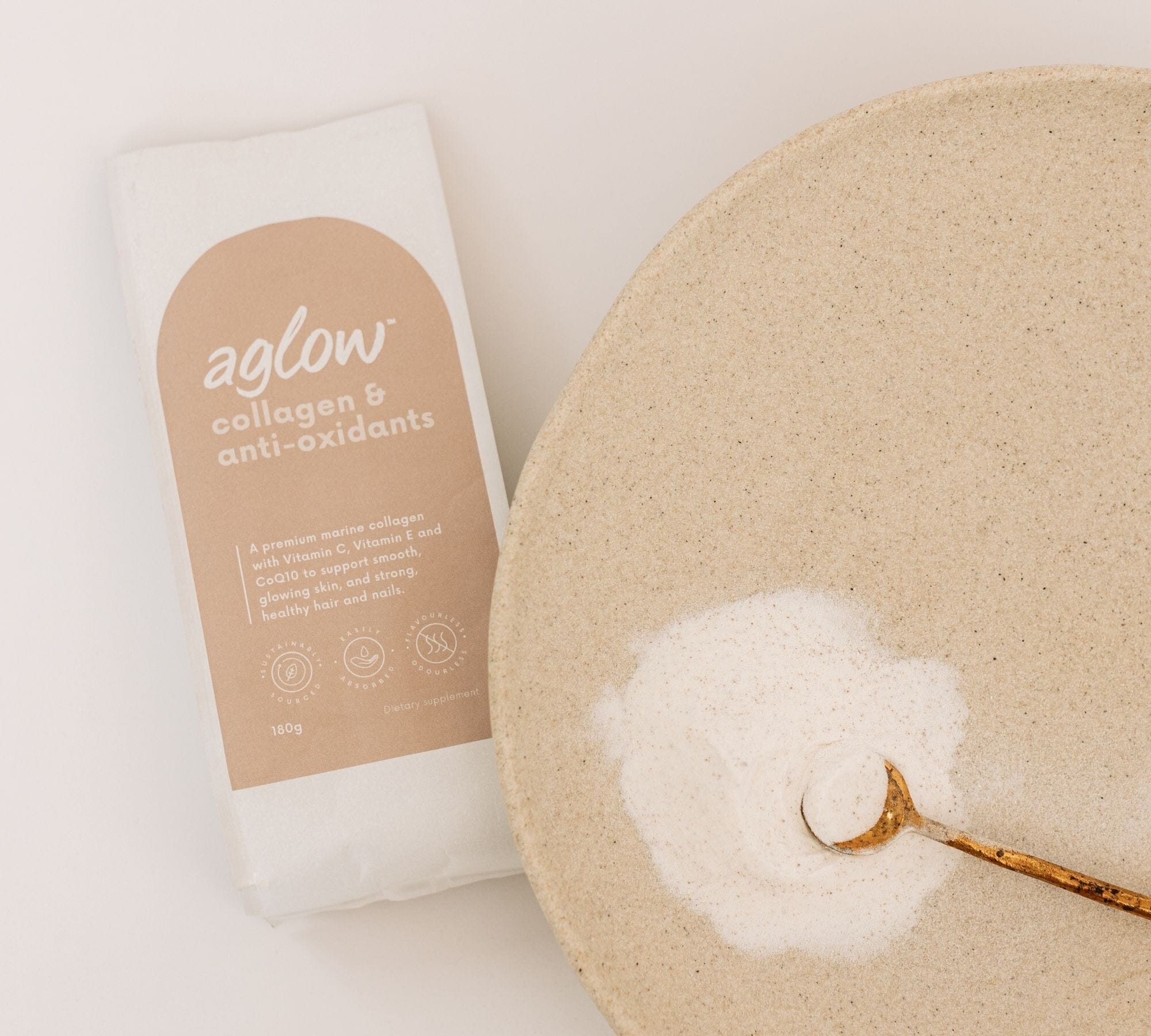 Unflavoured Marine Collagen with Antioxidants Refill Home Compostable Pouch with some Collagen poured on a platemarine collagen